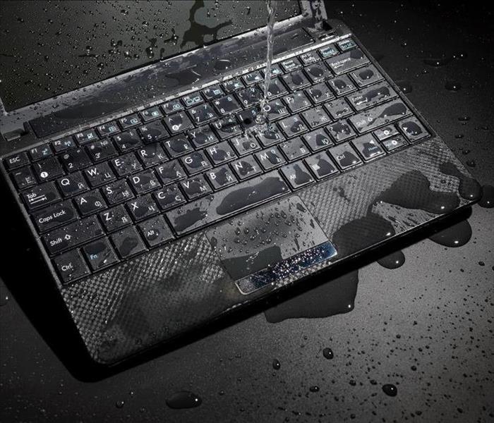 A laptop covered in water.